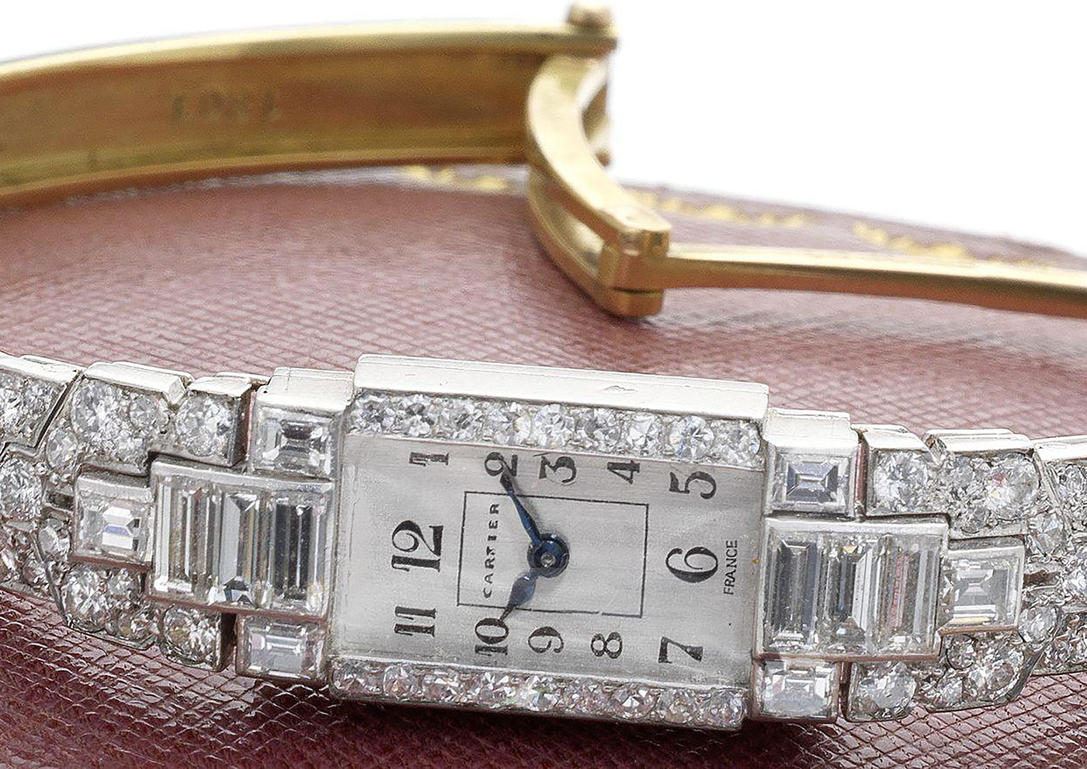 A 1930s-era Cartier platinum and diamonds cocktail watch. Image courtesy of Bonhams